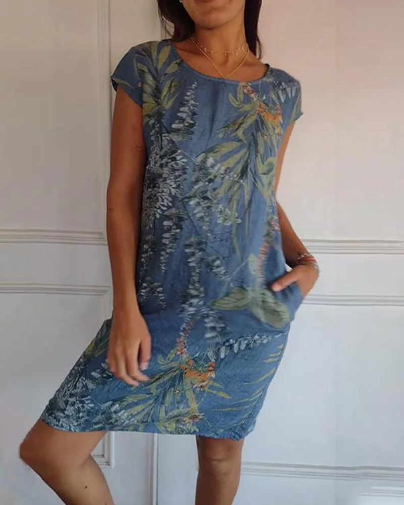 Versatile women's printed summer dress with a round neck, offering effortless style for casual days or events.