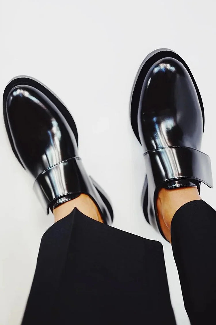 Comfortable women's polished slip-on loafers featuring an elegant strap, perfect for casual chic or professional use.