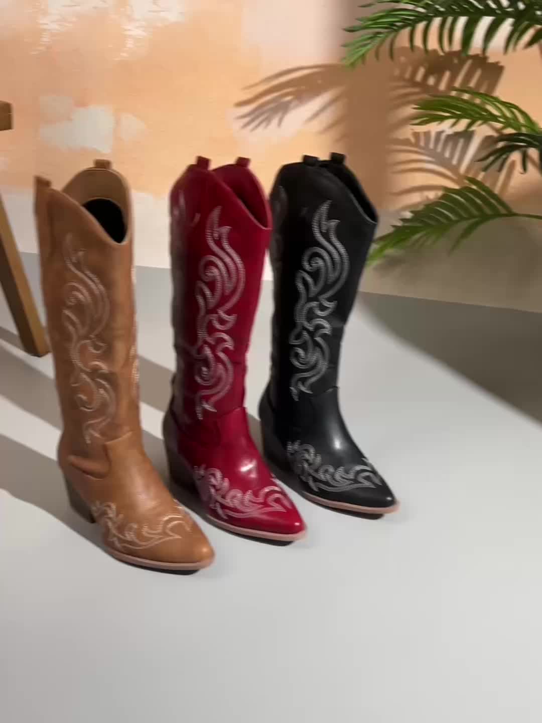 Women's knee high western boots, faux leather with detailed stitching and a comfortable, stylish design.