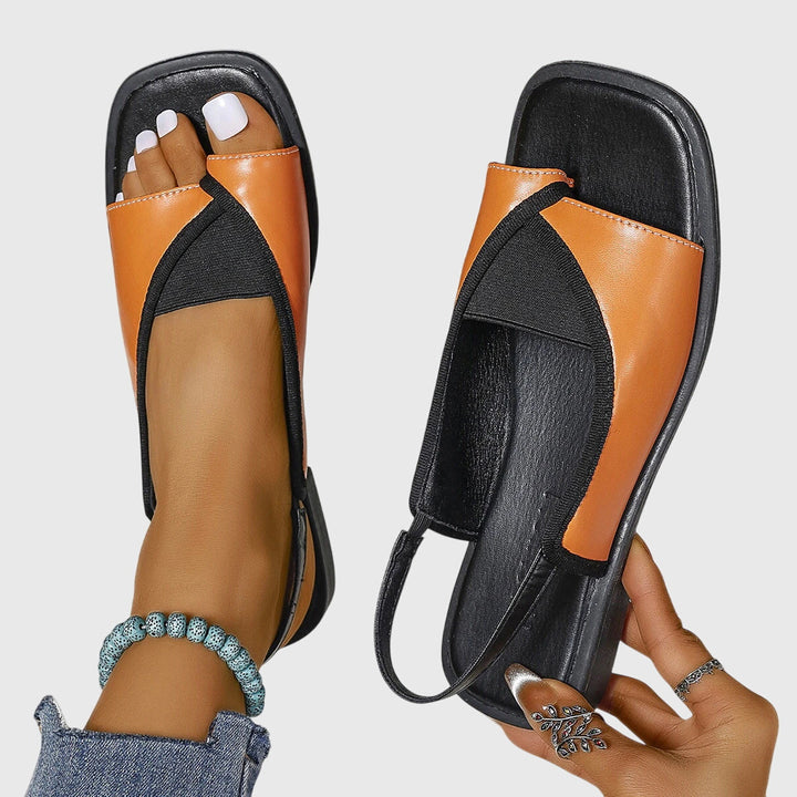 Comfortable women's flat sandals featuring a chic square-toe. Perfect everyday slip-on summer shoes.