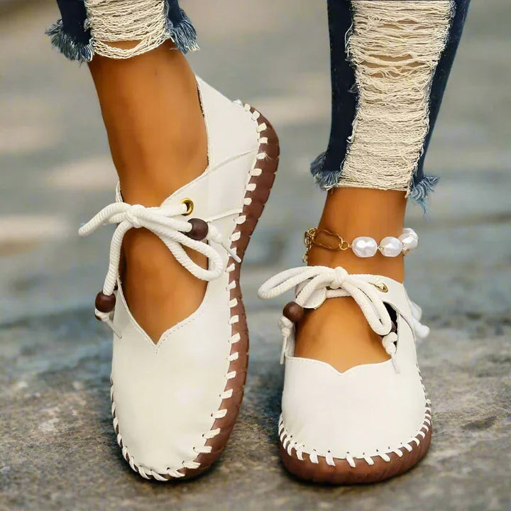 Women's wide toe box flats, lace-up style, offering bunion relief and dressy comfort for any occasion.