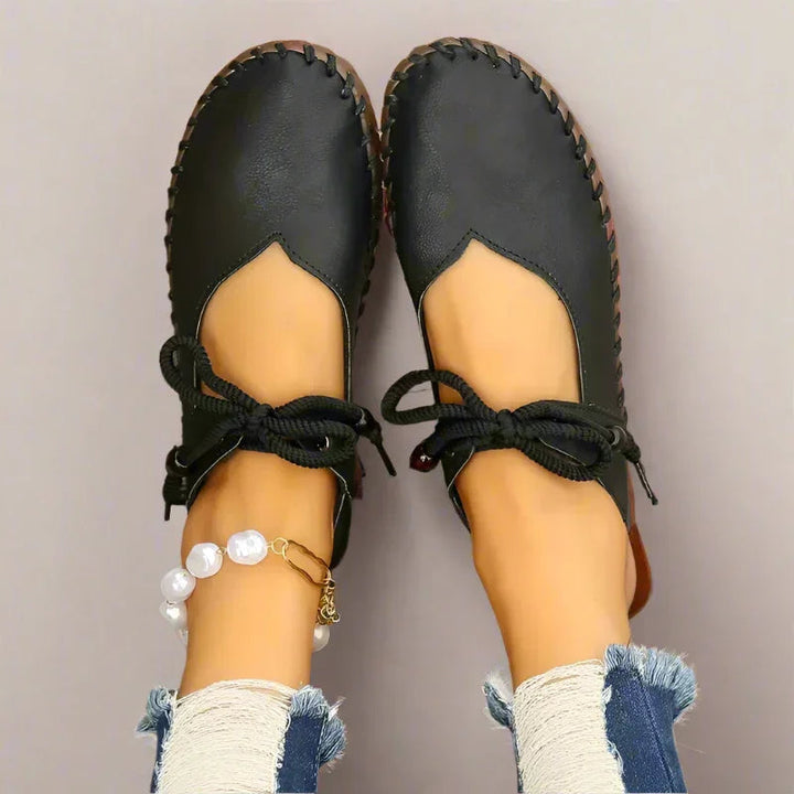 Dressy women's lace-up flats with wide toe box, engineered for bunion comfort & refined look.