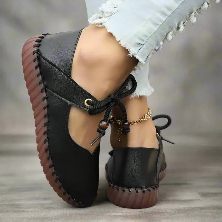 Comfortable women's wide toe box lace-up flats offering bunion relief and elegant styling.
