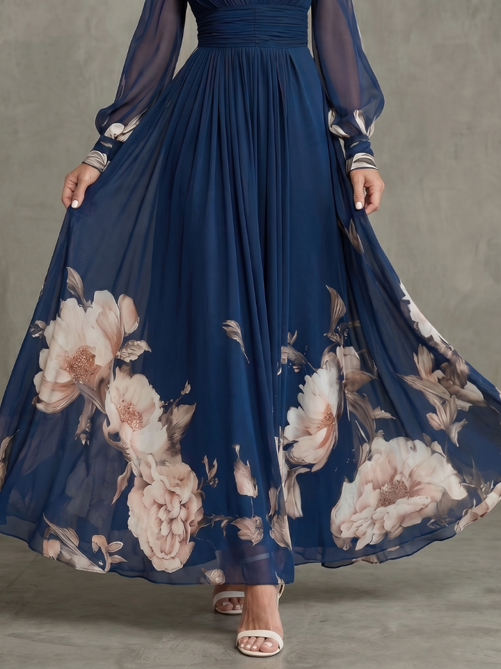 Elegant navy maxi dress with sheer pleated sleeves, ideal for parties, evening events, and formal occasions.