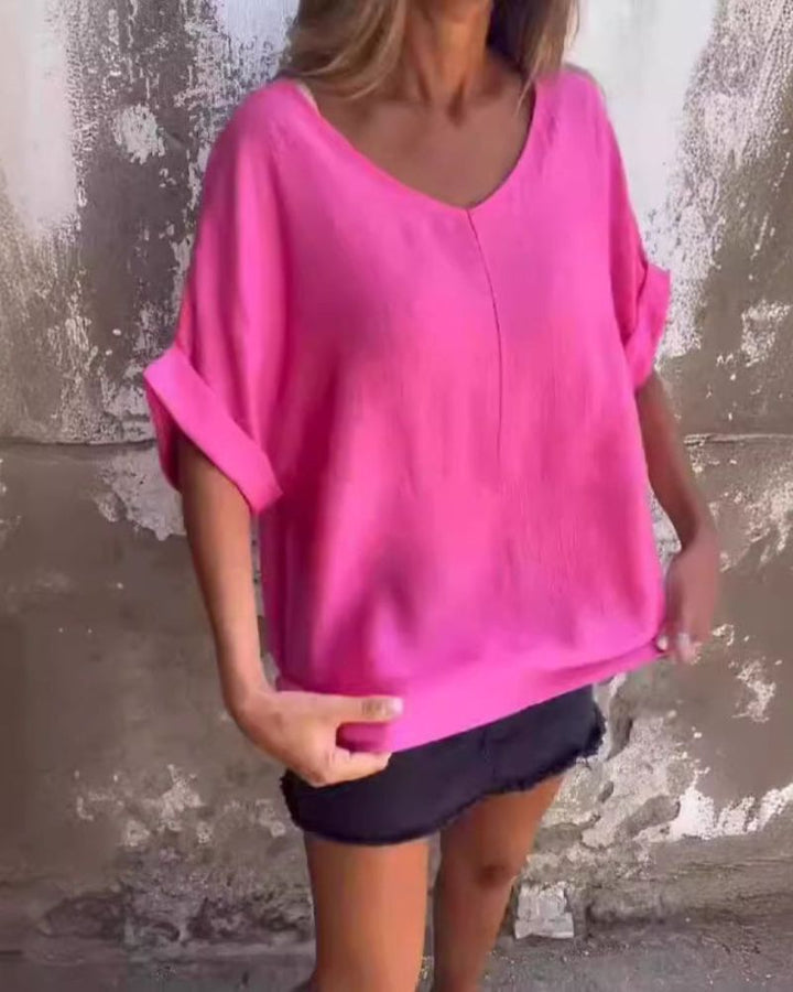 Flowy women's V-neck t-shirt, a stylish short sleeve top for summer. Loose fit & comfortable for casual fashion.