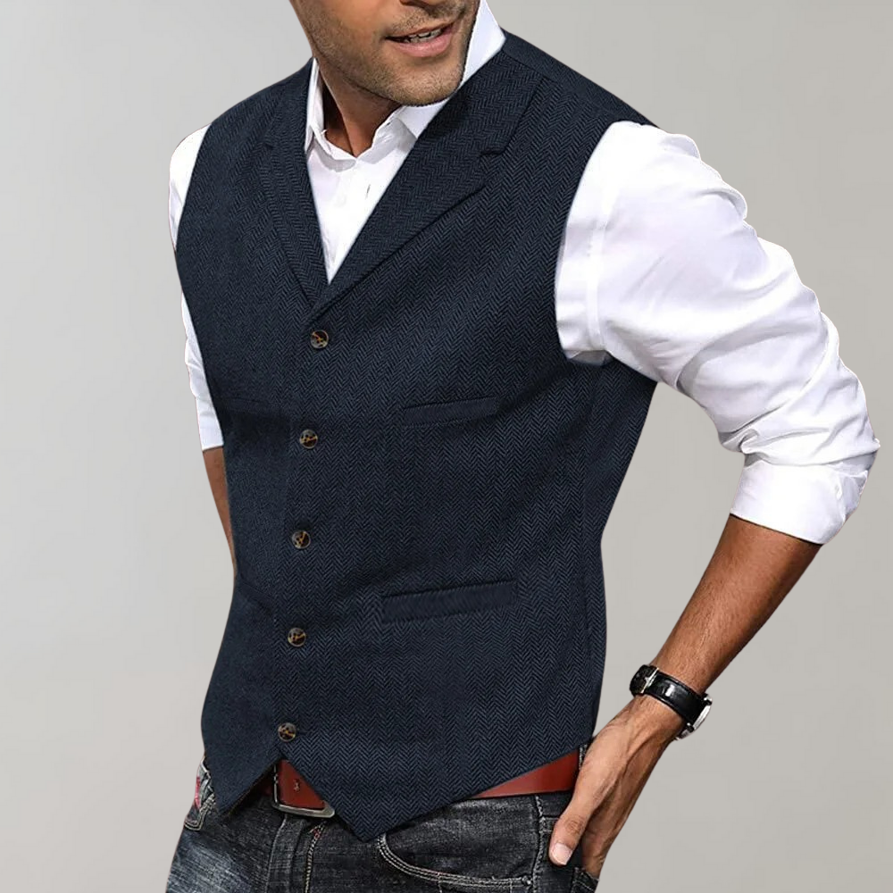 Classic men's button-up herringbone vest. Timeless fashion piece for a sharp, layered look.