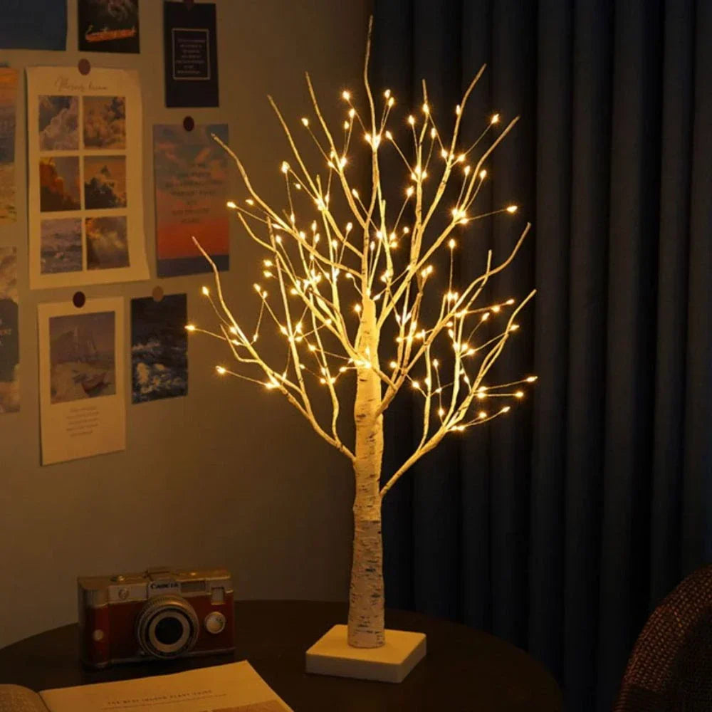 Ambient LED birch tree lamp, casting a cozy warm white light, ideal for relaxing bedroom decor.