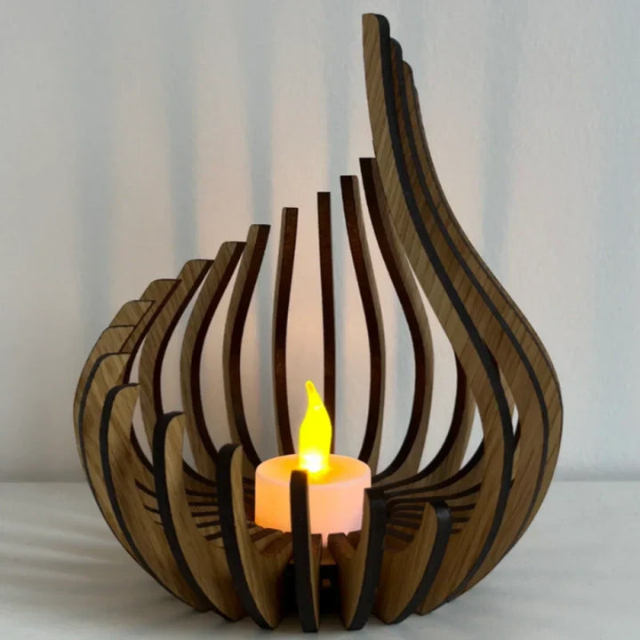 Close-up of a hollow carved wooden tea light holder, showcasing intricate wood art and design.