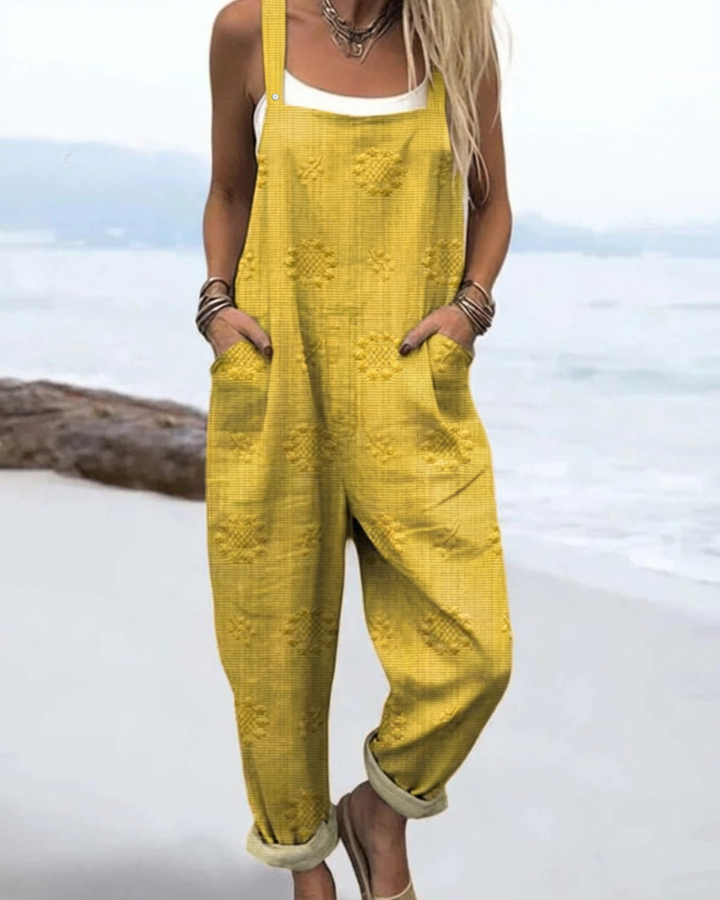 Fashionable women's floral jumpsuit with a wide-leg cut. Effortless, elegant, and comfortable for summer.