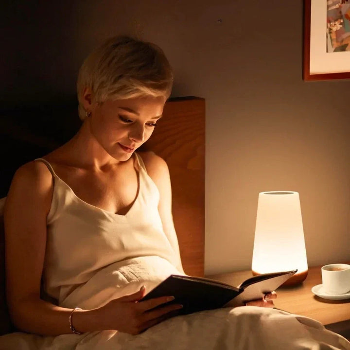 Portable rechargeable RGB LED lamp, ideal bedside light & home decor with touch control.