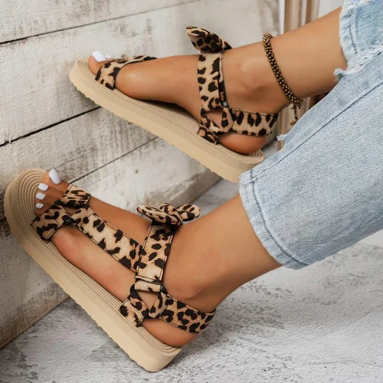 Chic women's leopard print sandals, stylish slip-on design for fashion-forward summer comfort.