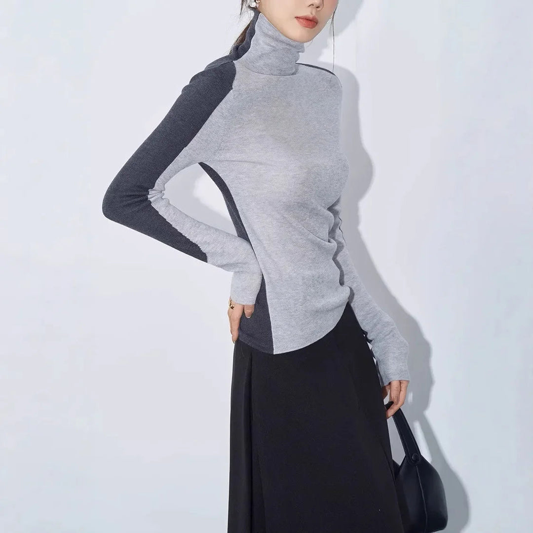Ladies' comfy mock neck long sleeve sweater with striking contrast design. Versatile for stylish everyday wear.