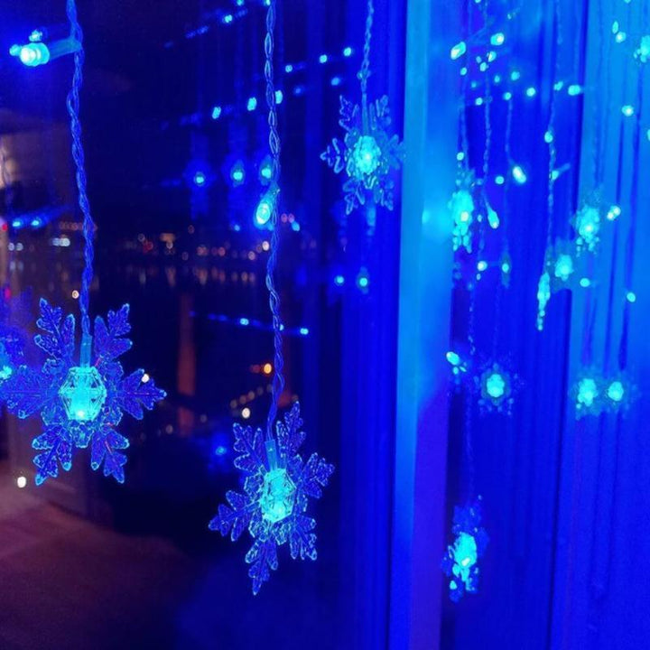 Decorative LED snowflake fairy lights, ideal for festive ambiance & decorative lighting.