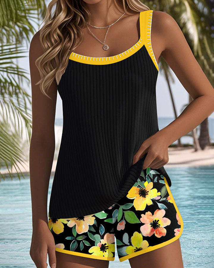 Vibrant orange and fuchsia women's tankini set, stylish two-piece swimwear for vacation.
