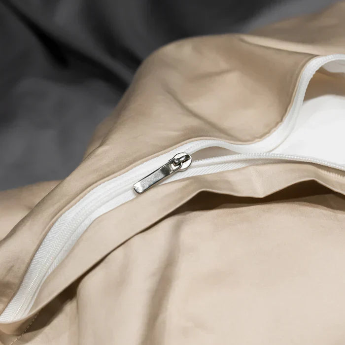 Soft & comfortable white cotton bedding set, featuring exquisite embroidery. Ideal for a serene bedroom.