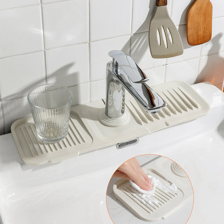 Keep kitchen countertops dry with this DripGuard self-draining silicone sink mat & dish drainer.