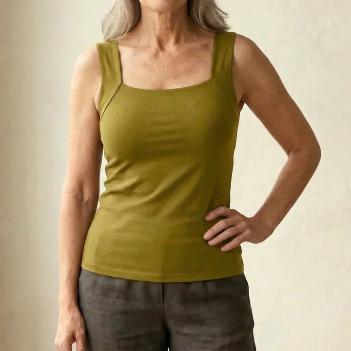 Soft women's built-in bra tank in white, ideal for ultimate comfort and gentle support.
