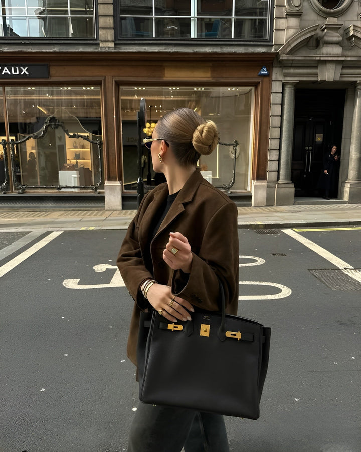 Sophisticated women's blazer, single-button design for an elegant, classic look. [[lstfy-media:5]]