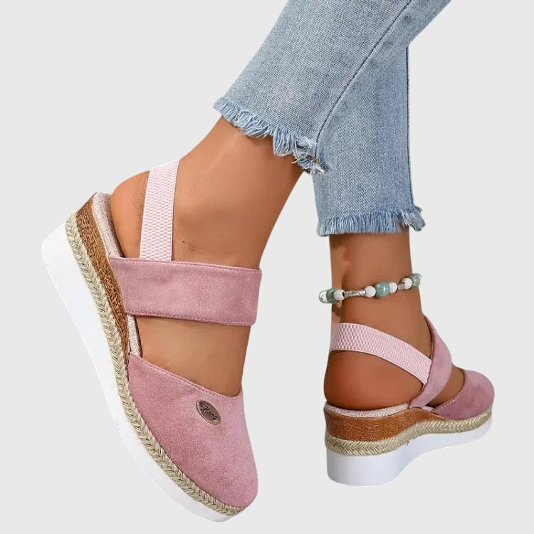 Supportive women's orthopedic sandals promoting foot health with cushioned sole & arch support.