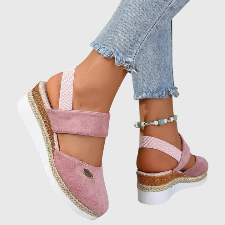 Supportive women's orthopedic sandals promoting foot health with cushioned sole & arch support.
