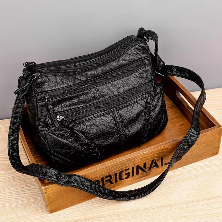 Brown genuine leather shoulder bag for women. Soft, durable, versatile handbag for sophisticated daily use.