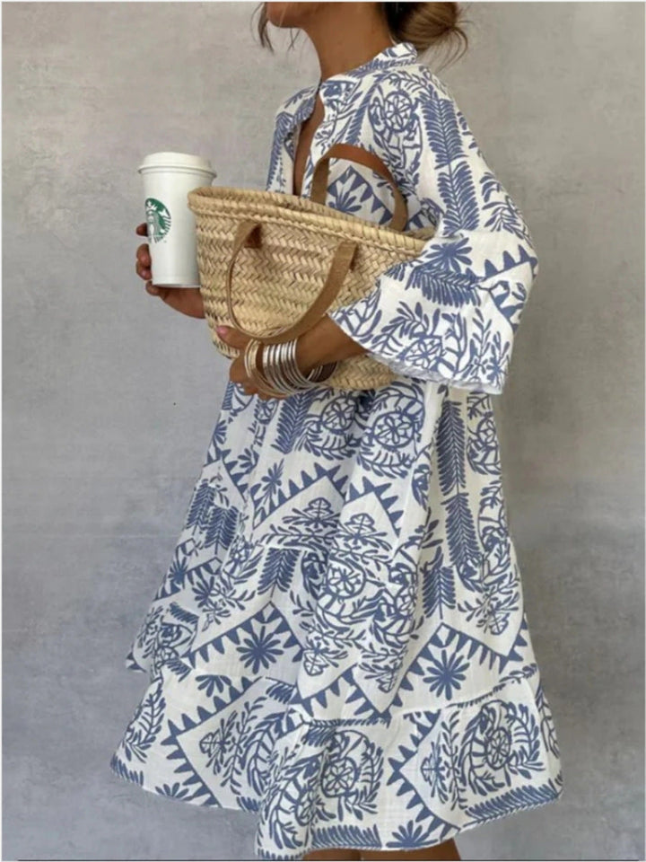 Model wears a relaxed fit women's floral print midi tunic dress, embracing comfortable spring/summer fashion.