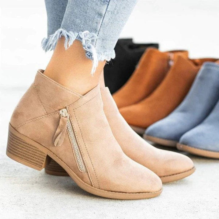 Stylish women's ankle boots featuring a practical side zip & comfortable low block heel. Perfect for casual wear.