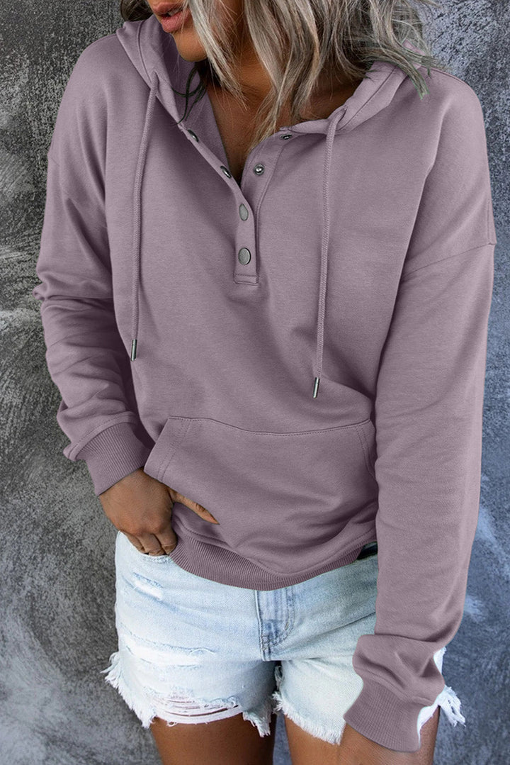 Close-up of the soft fabric on a women's cozy hooded sweater. Comfortable apparel.