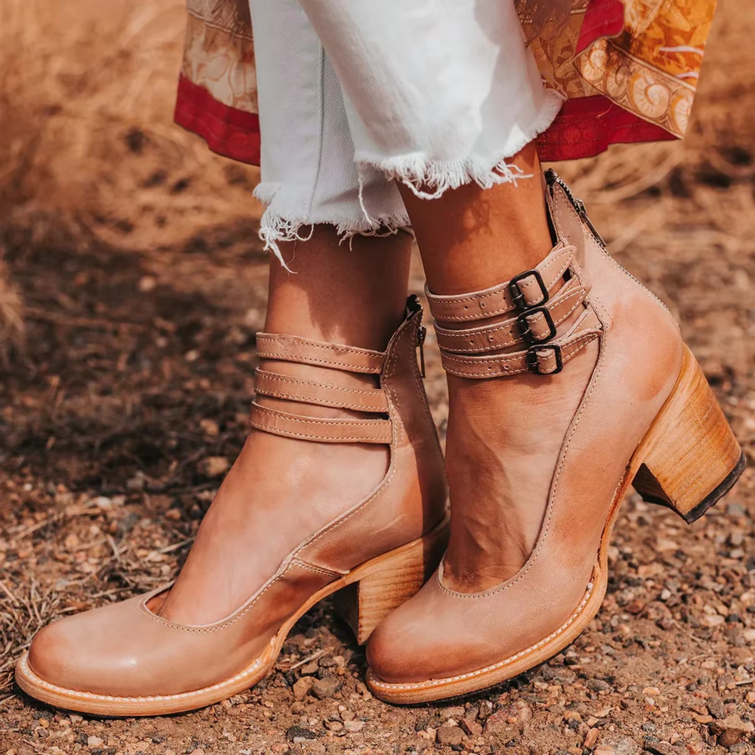 Classic women's orthopedic ankle boots with strappy details, comfortable block heel, and round toe.
