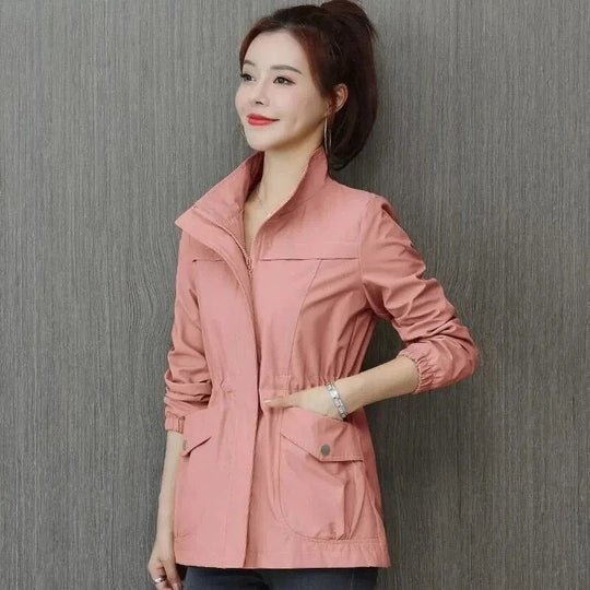 Stylish women's waterproof cinched-waist jacket, lightweight & versatile for spring/fall outerwear.