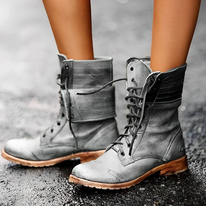 Rugged yet stylish women's black lace-up combat boots. Ankle boots with durable design, ideal for versatile fashion.