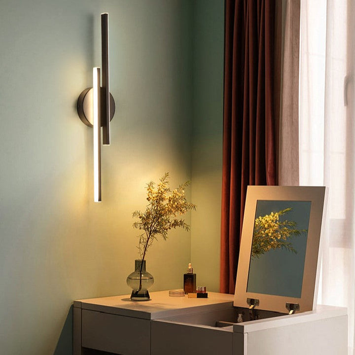 Sleek modern wall sconce, ideal for interior design. Provides adjustable, dimmable LED accent lighting.