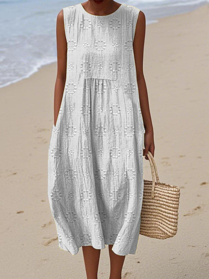 Full-length view of a women's sleeveless summer pocket dress, ideal for elegant casual wear or vacation.