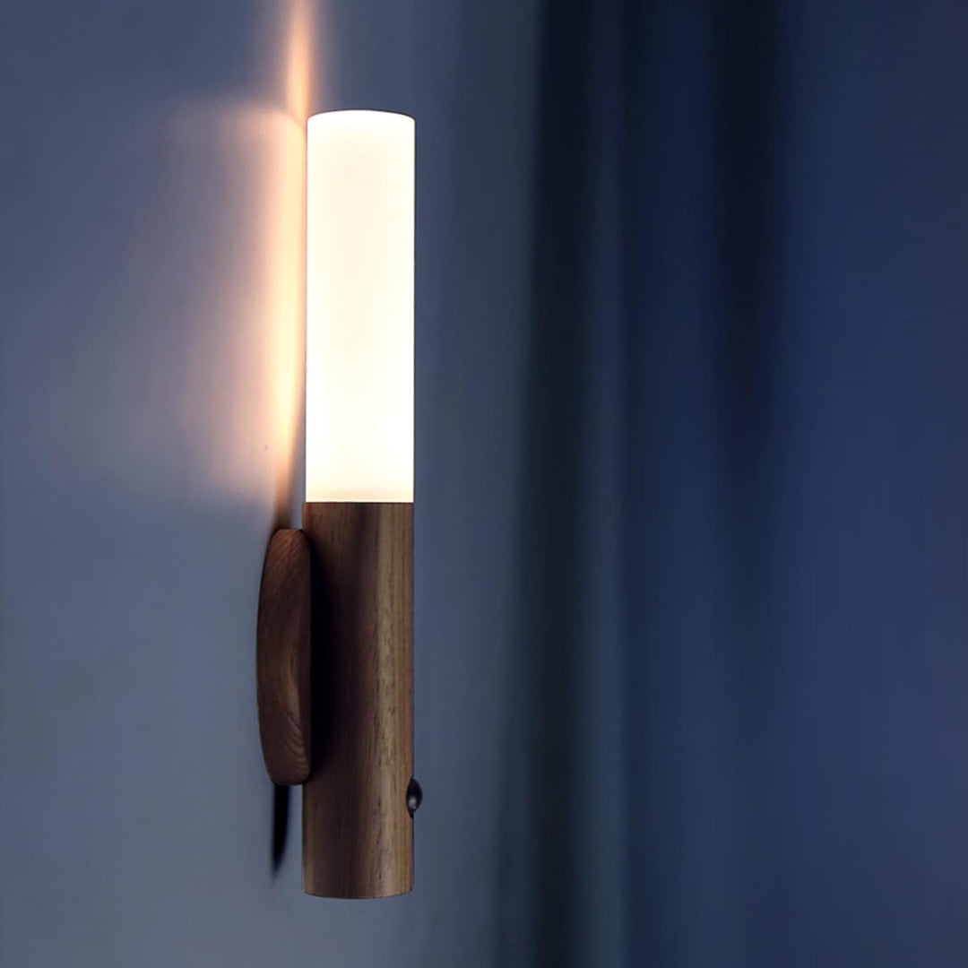 Modern motion sensor LED wall light, rechargeable and magnetic for cordless home decor.