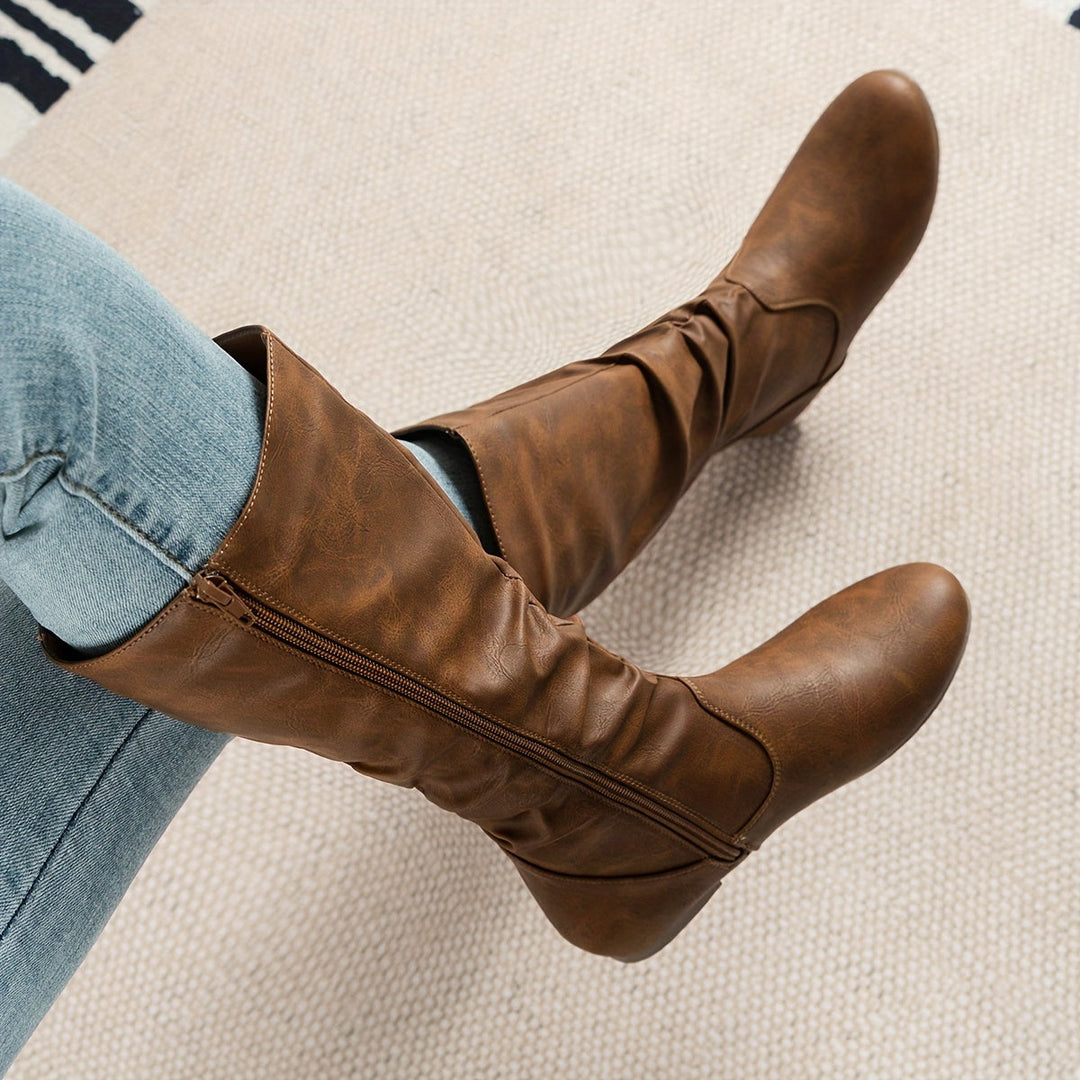 Women's stylish knee-high gathered boots with flat sole for comfortable fall and winter everyday wear.