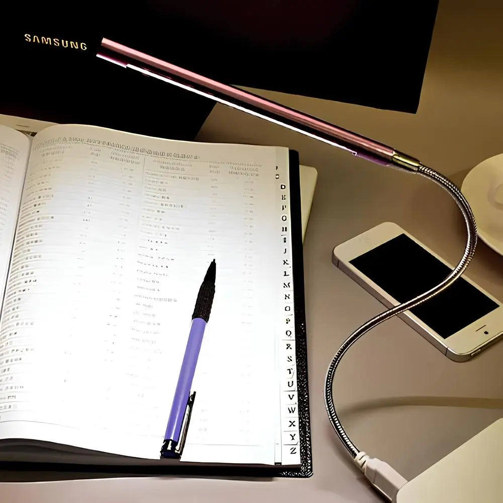 Portable USB gooseneck LED lamp for keyboards, offering adjustable and dimmable task lighting.