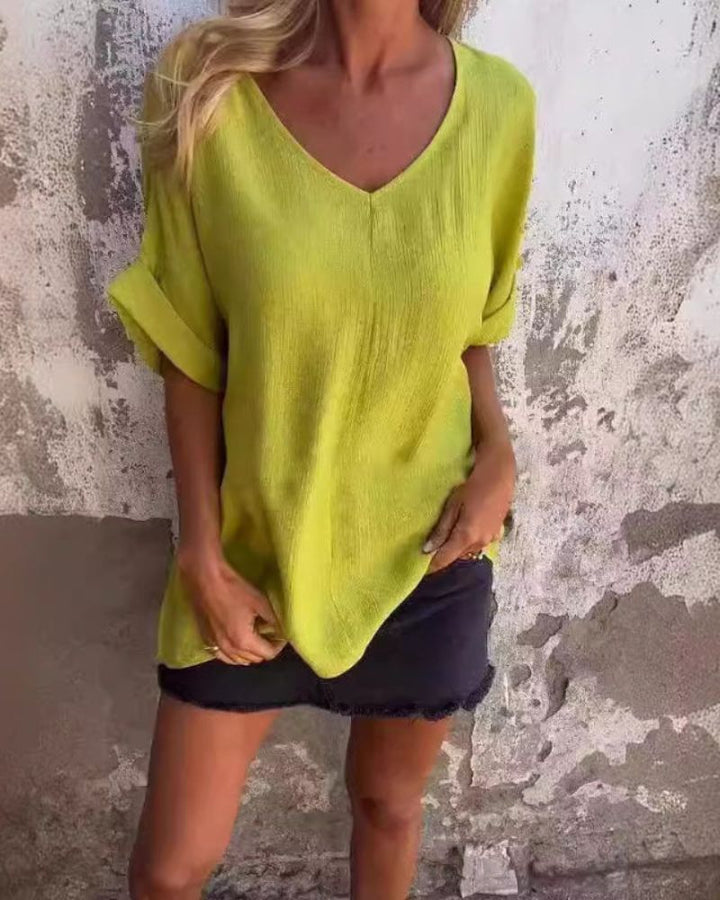Stylish women's v-neck t-shirt with a loose, comfortable fit for casual everyday wear. Perfect short sleeve summer top.