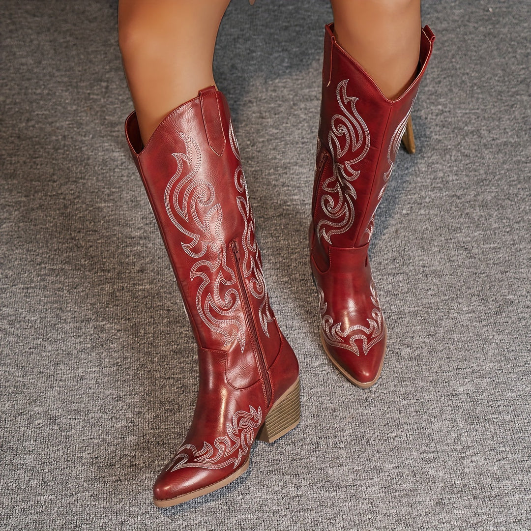 Tall women's embroidered western boots, featuring a classic pointed toe and sturdy block heel for comfort.