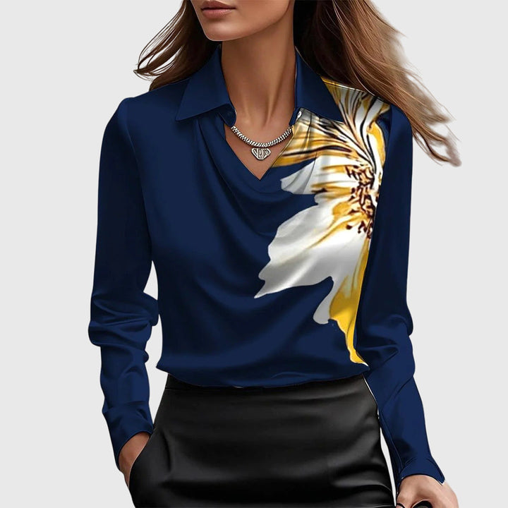 Chic women's top with an elegant pleated neckline. Versatile blouse, great for both office & evening.