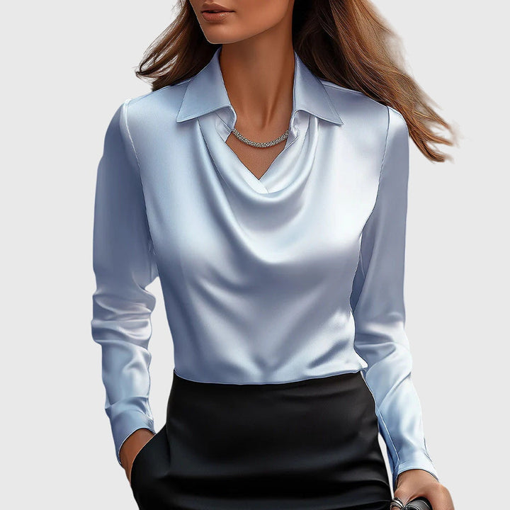 Dressy women's evening top with an elegant pleated neckline. Flowing fit blouse for chic style.