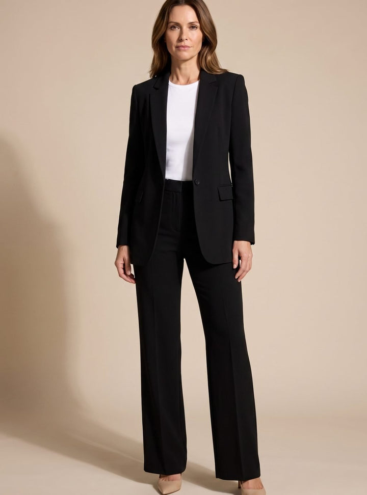 Professional women's elegant two-piece suit: chic blazer & stylish flared trousers for a modern office look.