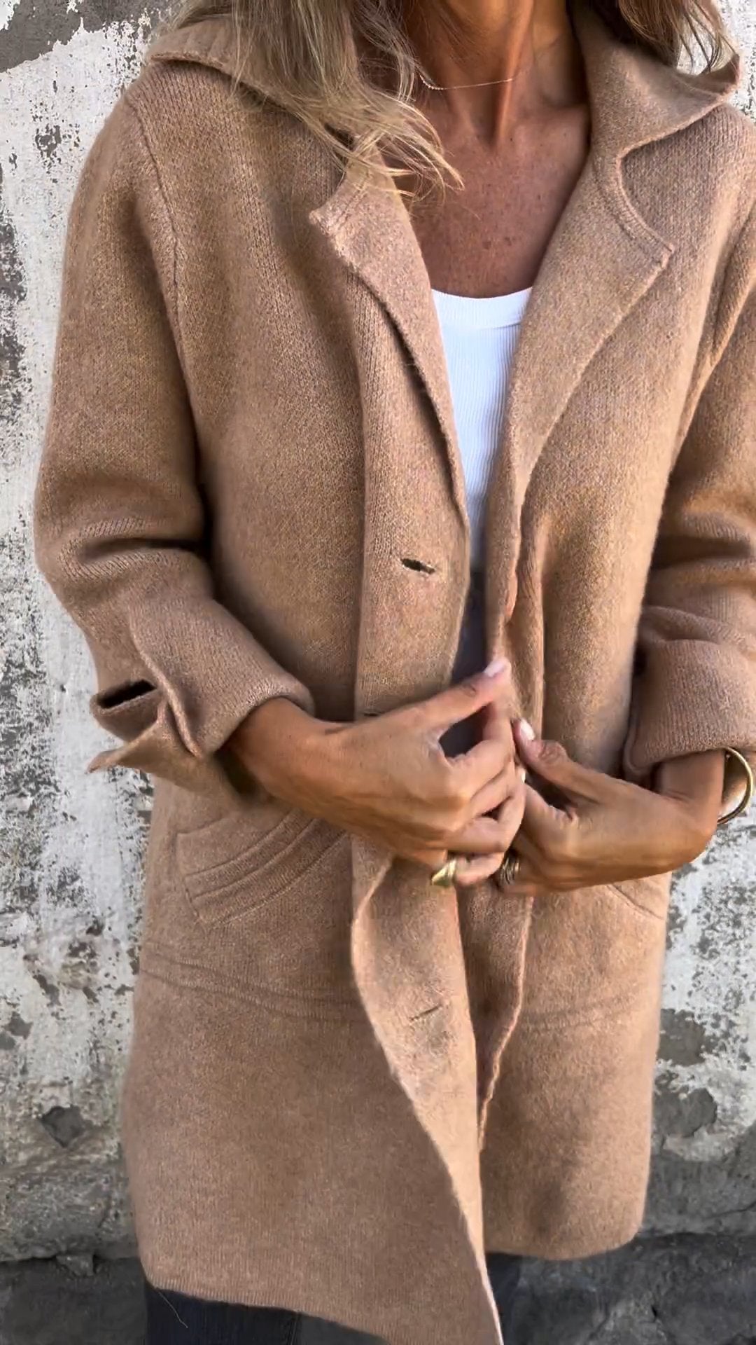 Women's fashionable long button coat for autumn. Elegant outerwear, perfect for stylish & comfortable fall looks.