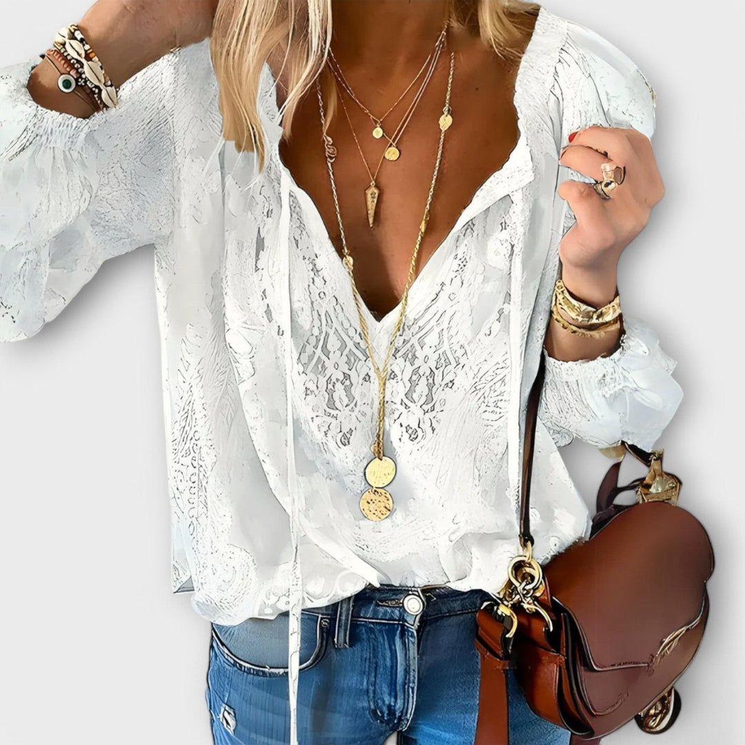 Elegant women's tie-neck blouse with long sleeves, perfect for office wear or sophisticated casual chic.