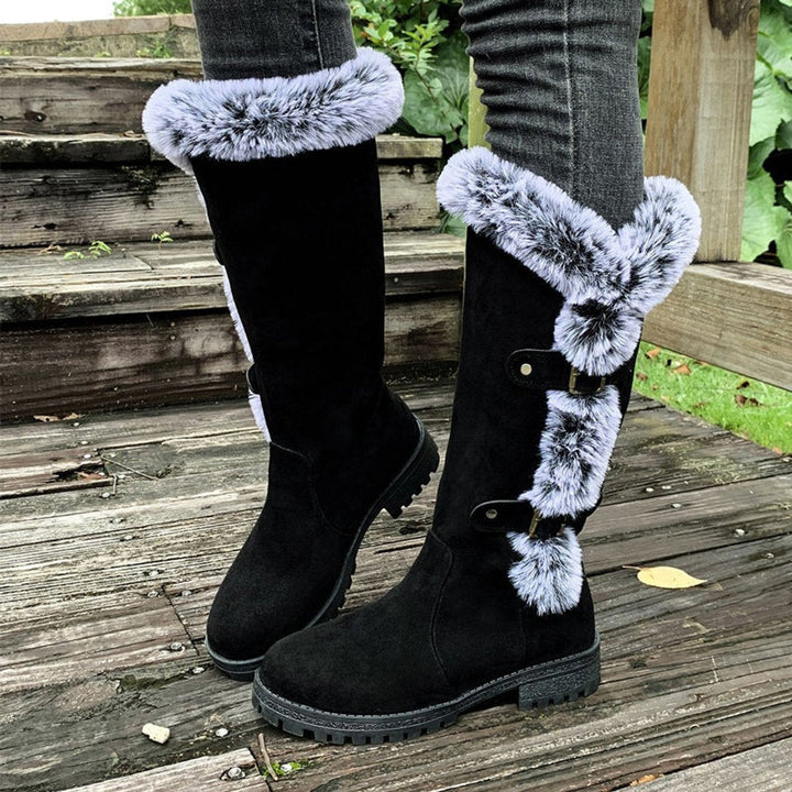 Fall/winter women's fashion boots: cozy fur trim, knee-high design, & decorative buckles.