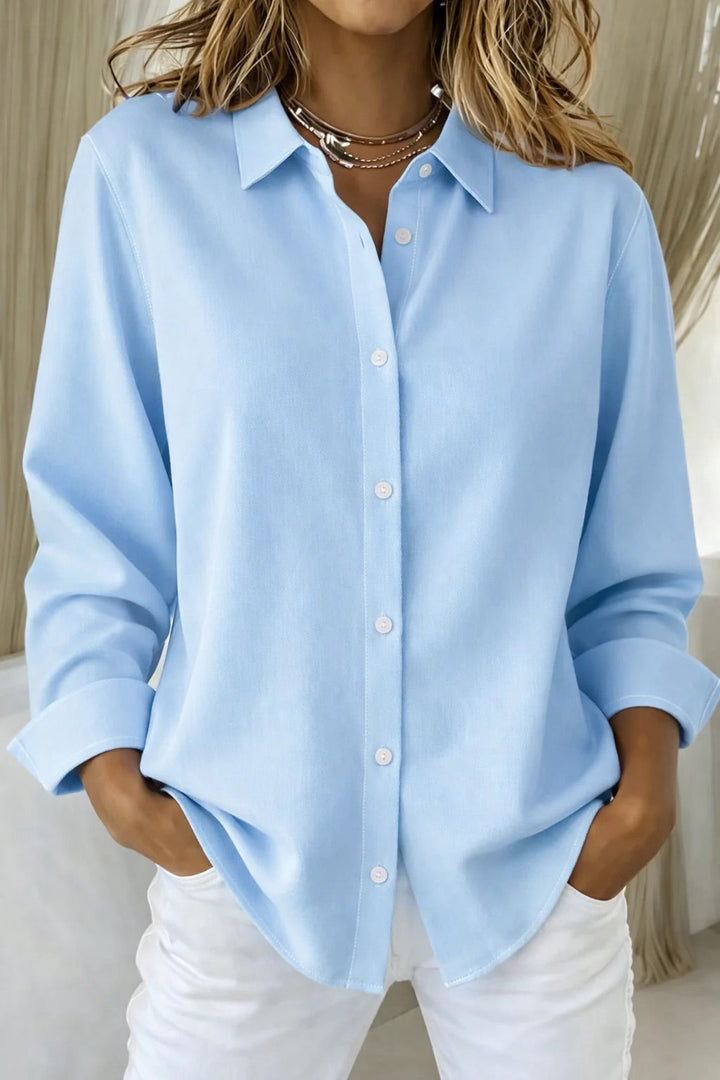 Fashionable women's button-up blouse, long sleeve, an elegant top offering versatile style for any occasion.
