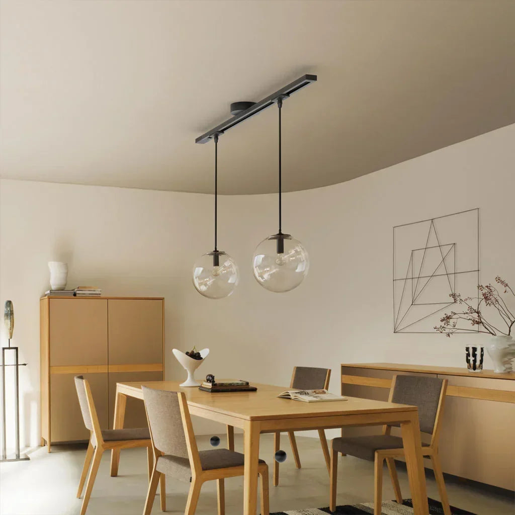 Stylish white pendant light rail. Customizable illumination for modern interior design.