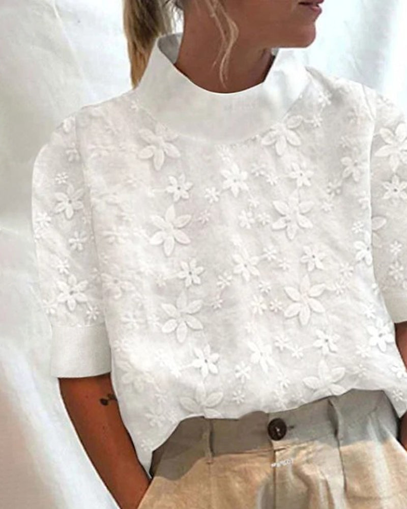 Elegant women's white embroidered stand-up collar blouse. Sophisticated ladies top for fashion apparel.