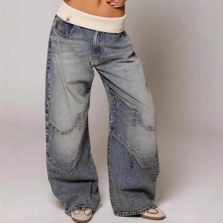 Full shot of women's vintage light wash wide leg patchwork jeans. Baggy, comfortable, and trendy for casual wear.
