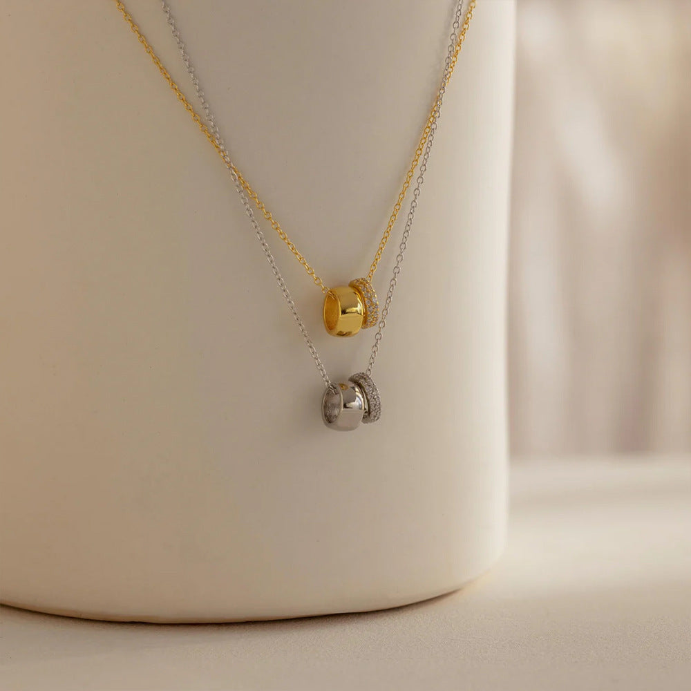 Stylish women's necklace, a perfect gift for her. Features an elegant duo ring and double circle pendant design.