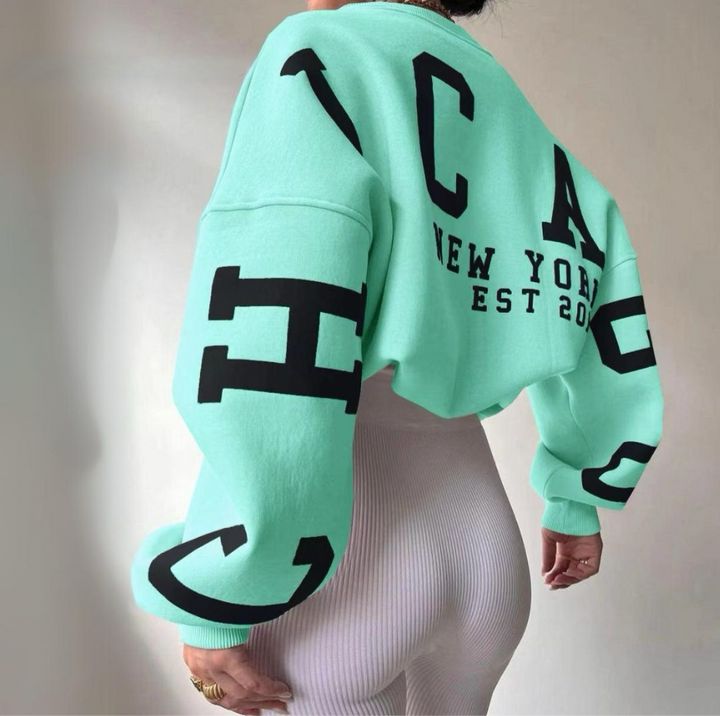 Stylish women's oversized top, cozy long sleeve, perfect for casual comfort.